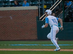 UNC Redshirt Freshman Infielder and Outfielder Casey Cook (16) runs to first base in the Feb. 28, 2023 game against ECU.