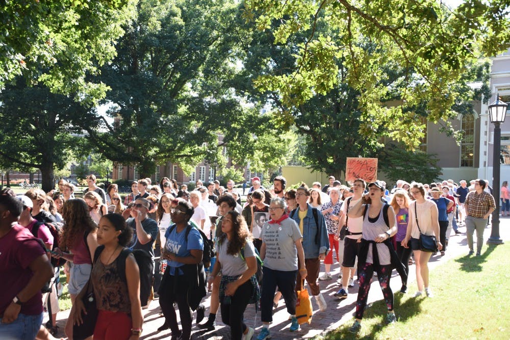 <p>Protestors march from South Building to Silent Sam during the Solidarity Rally and March for the Center for Civil Rights Thursday.&nbsp;</p>