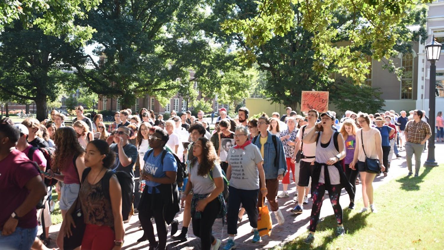 Protestors march from South Building to Silent Sam during the Solidarity Rally and March for the Center for Civil Rights Thursday.&nbsp;