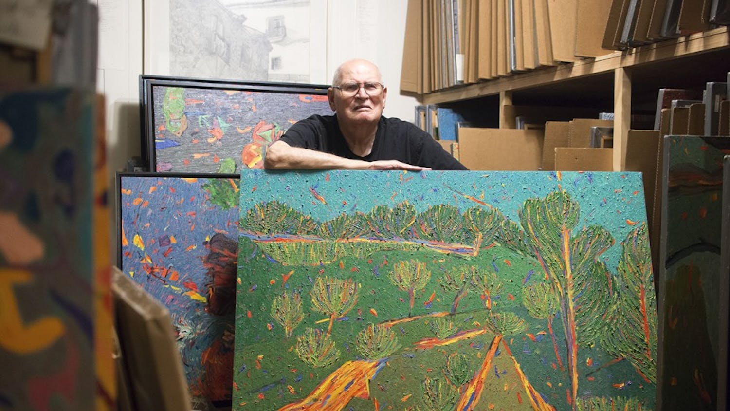 Marvin Saltzman poses with his artwork in his studio, located in Chapel Hill on July 22nd. A small portion of Saltzman's thousands of pieces is currently on display in the Eno Gallery in Hillsboro. 

"I draw from nature, and then I paint about nature."
"Bad teachers train, good teachers open doors."