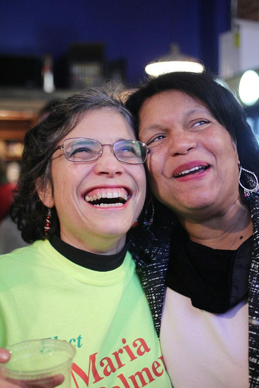 Maria Palmer celebrates with Delores Bailey at Vimala's Curryblossom Cafe after winning the election to the Chapel Hill Town Council Tuesday. 