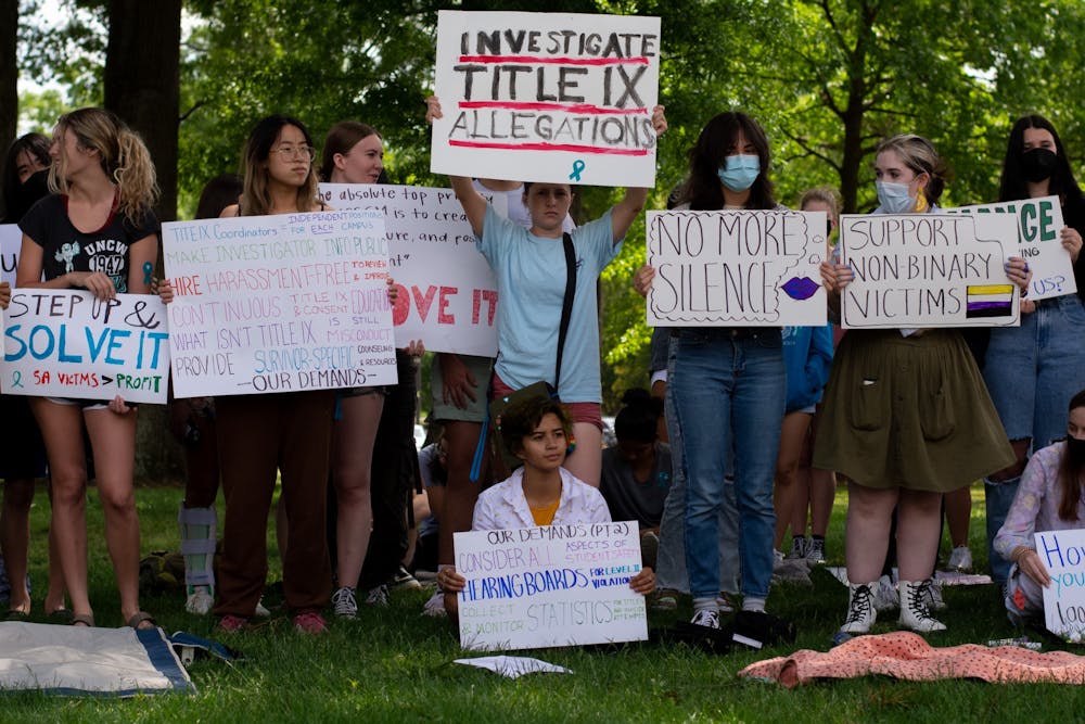 On May 3, 2022, students at the North Carolina School of Science and Math, in Durham, NC, sit and stand in silent protest of title IX cases and assault accusations. Students say these cases have resulted in no action by NCSSM administration.