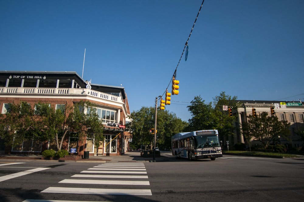 A Chapel Hill Transit bus approaches Franklin Street on Wednesday, June 24, 2020 after the new safety regulations due to COVID-19 had been implemented.