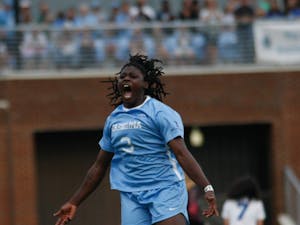 UNC women's soccer forward, Ru Mucherera (3), tries to hype up the sold out crowd during the game against Duke on Sunday August 25, 2019. UNC beat Duke 2-0.
