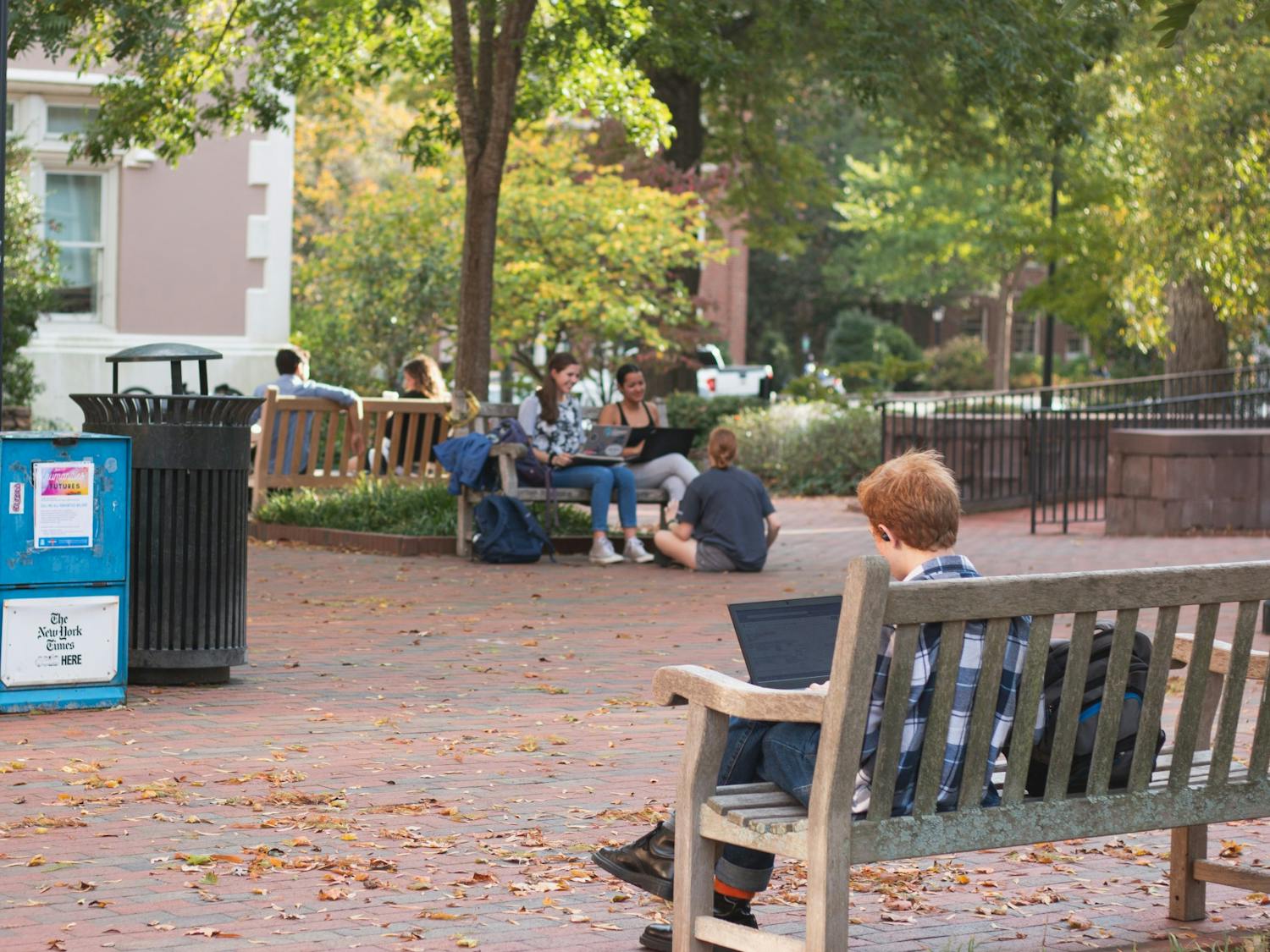 Students sit by the Campus Y on Thursday, Oct. 31, 2019. Students may be unaware of the looming possibility of a recession, potentially affecting their future job opportunities.