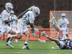 UNC freshman Midfielder, Zachary Tucci (35), attempts to get the ball Saturday in the game against Duke at the UNC Lacrosse Stadium.