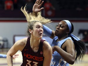 Virginia Tech's Elizabeth Kitley (33), drives on North Carolina's Janelle Bailey (44) during the first half of an NCAA college basketball game in Blacksburg Va. Sunday February 28 2021. Photo courtesy of Matt Gentry/AP Photo/The Roanoke Times