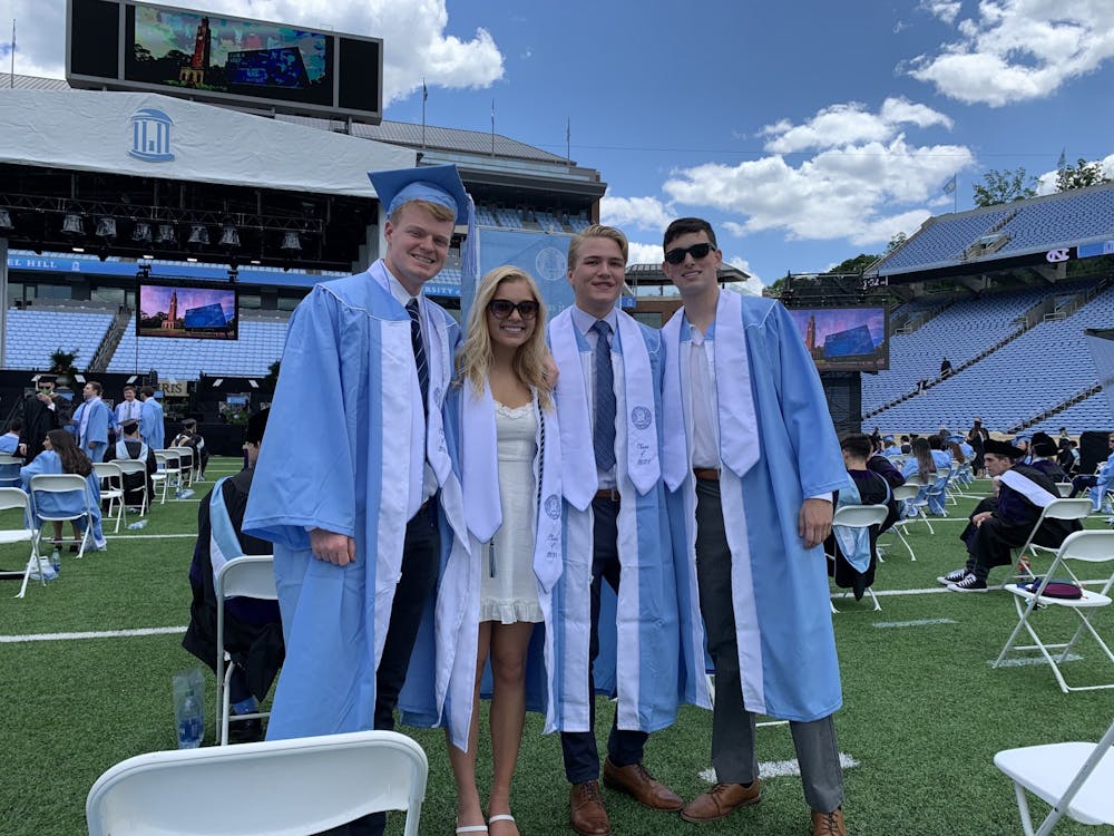 Owen Scrudders, Madison McClellan, Markus Haig, and Kevin Barth pose for a photo at their commencement ceremony in Chapel Hill on Saturday May 15, 2021. Photo courtesy of Civitella Witzke. 