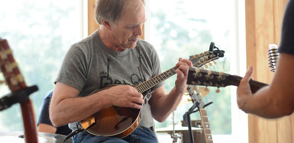 John Soper plays the mandolin.