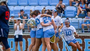 Members of the UNC women's lacrosse team celebrate a goal during their NCAA Tournament second round match against Virginia at Dorrance Field on Sunday, May 15, 2022. UNC won 24-2.