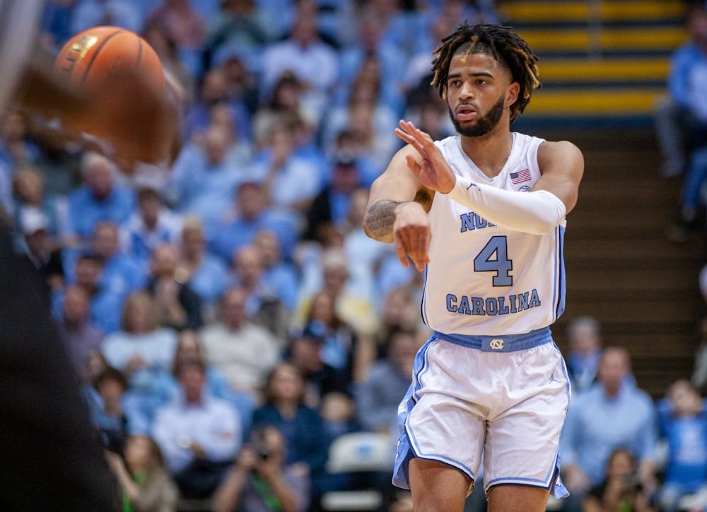 UNC junior guard RJ Davis (4) passes the ball in the Dean Smith Center on Jan. 4, 2023, against the Wake Forest Deamon Deacons. UNC won 88-79.