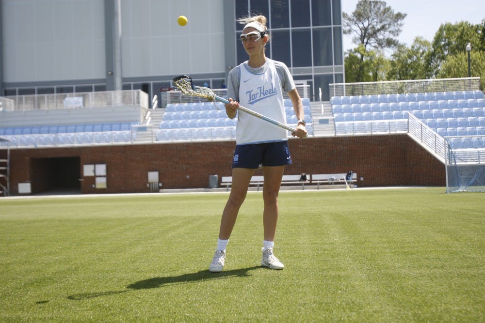 UNC women's lacrosse junior Katie Hoeg (8) stands in the new lacrosse/soccer stadium on Thursday, April 18, 2019. Hoeg has been playing lacrosse since she was in second grade.