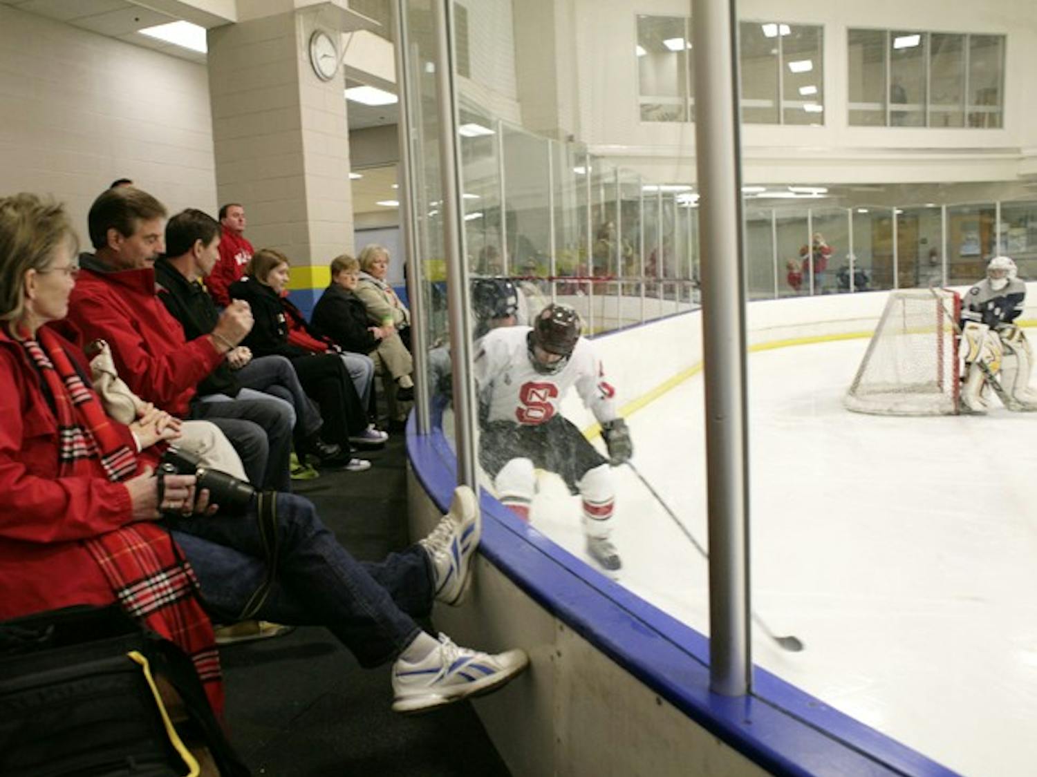 A small crowd gathered to watch the Georgetown v. NC State hockey game at the ACC Hockey Tournament at the Triangle Sportsplex in Hillsborough on Saturday. The tournament, which ran from Friday to Sunday, drew between 150 and 200 spectators on Friday night, according to Diane Thompson, mother of senior defensman John Thompson, who worked the door at many of the games this weekend. The tournament featured spirited competition from the athletes, regardless of the attendance. "They're playing for the name on the front of their jersey," said Thompson. "They're playing for pride."