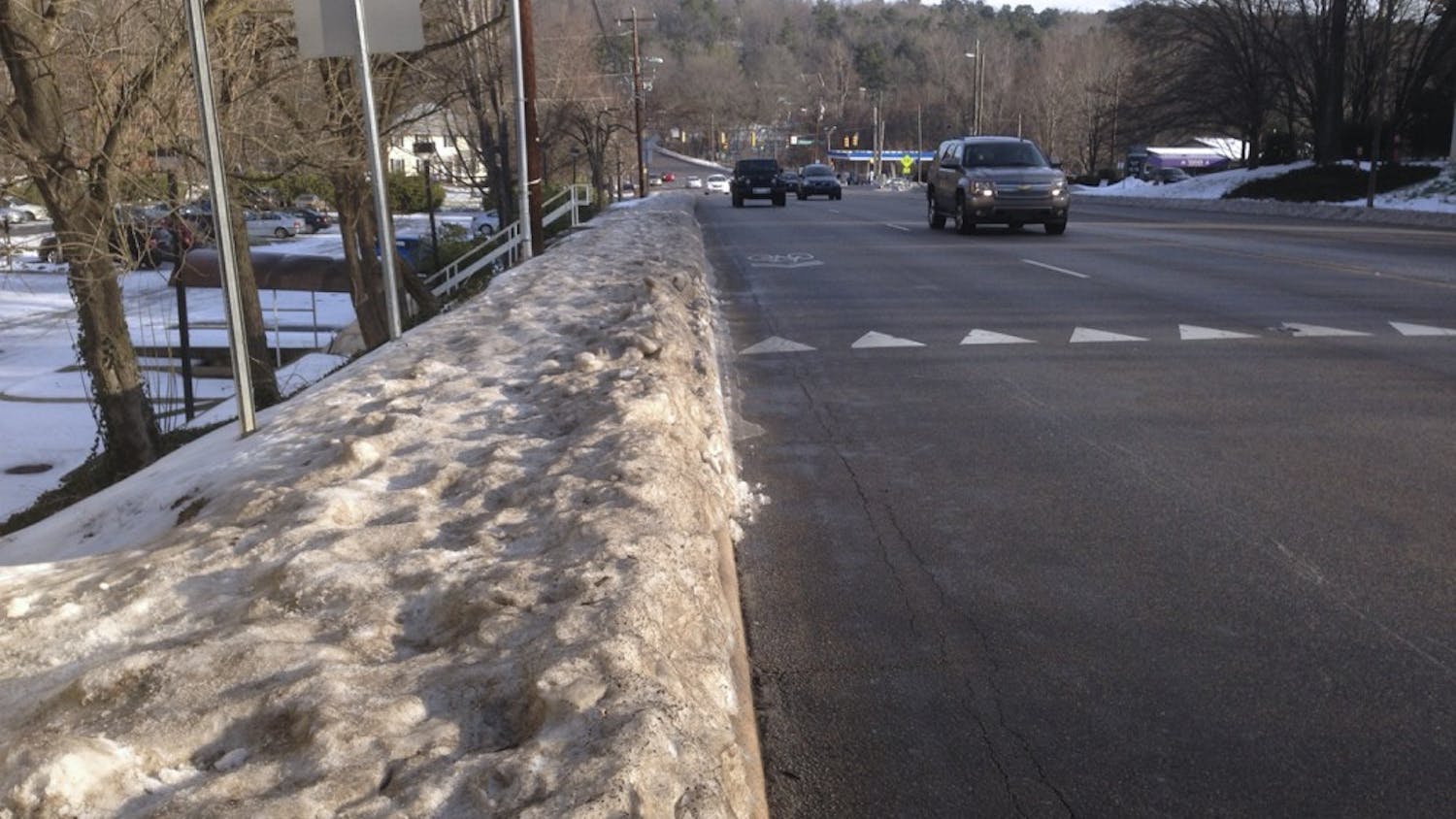 A view towards Hillsborough Drive on Martin Luther King Jr. Blvd. On Tuesday morning, the road was clear, and the sidewalks remained obstructed.