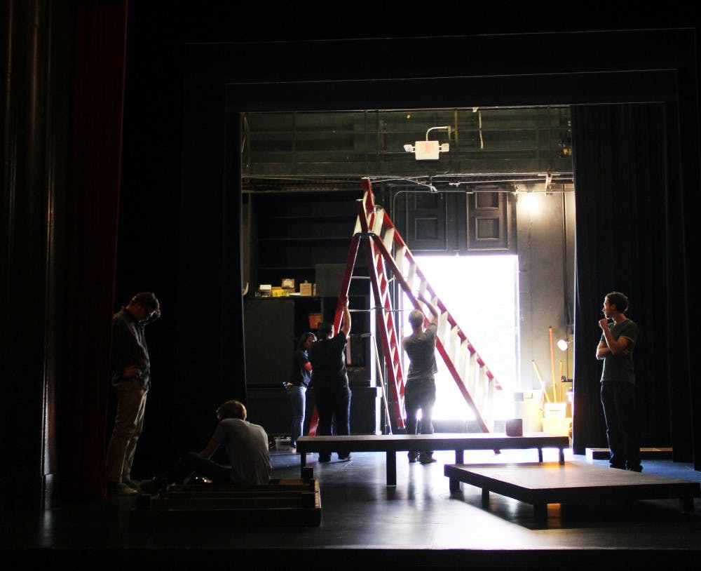 Members of the production staff help assemble pieces of the set for Doubt.