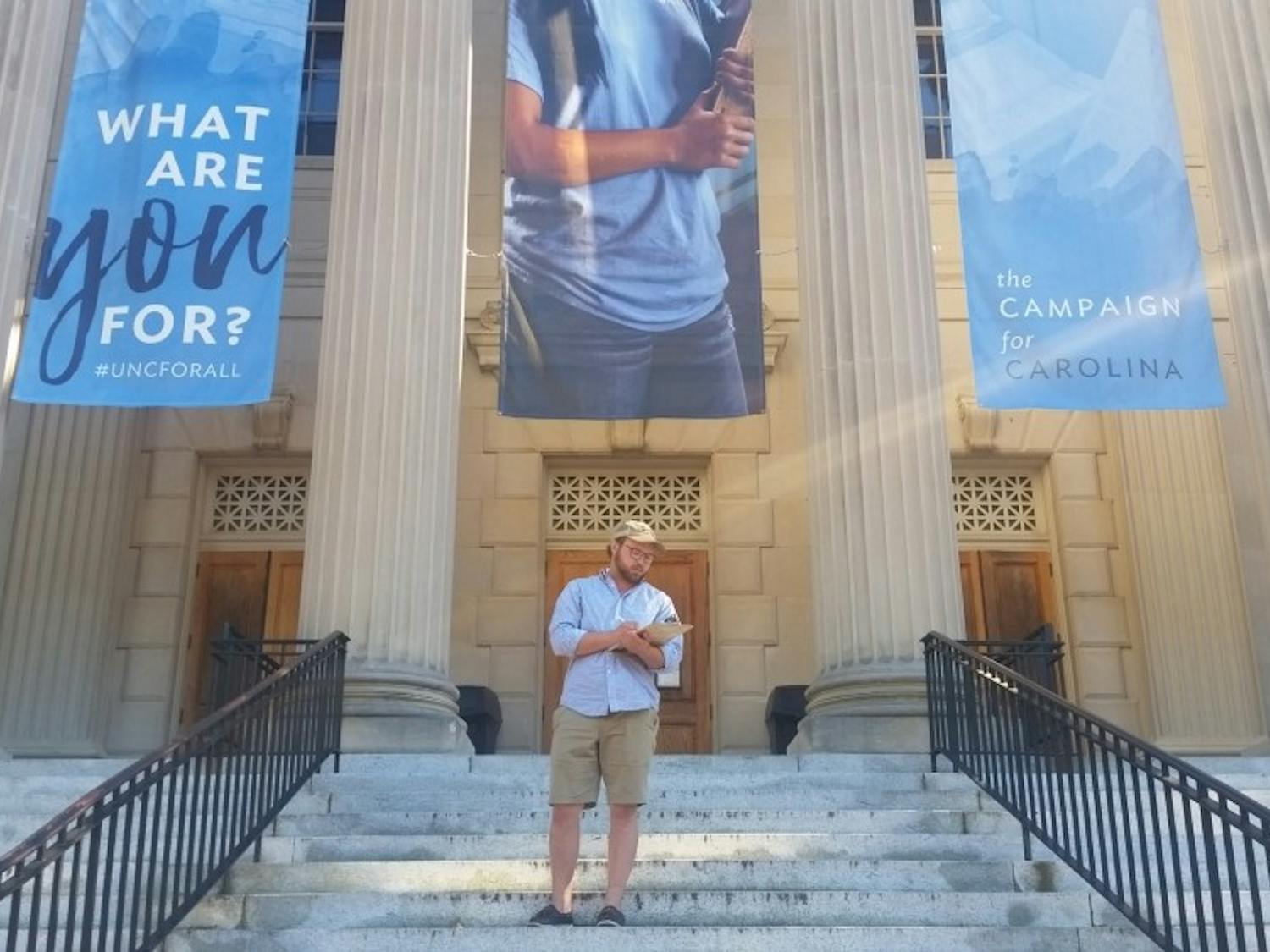Brian Fields, a senior Political Science major, is involved in local politics and often volunteers to help students register to vote in Chapel Hill, NC.