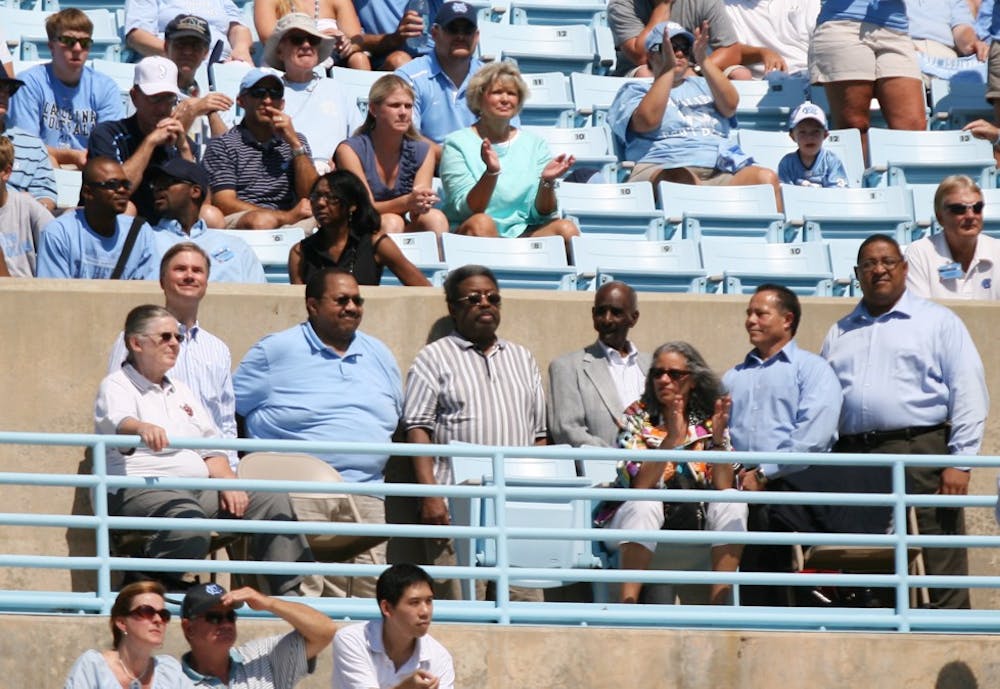First black students John Lewis Brandon and Ralph and LeRoy Frasier were honored at Saturday’s football game for the 55th anniversary of desegregation at UNC by Chancellor Holden Thorp and Vice Chancellor Winston Crisp.