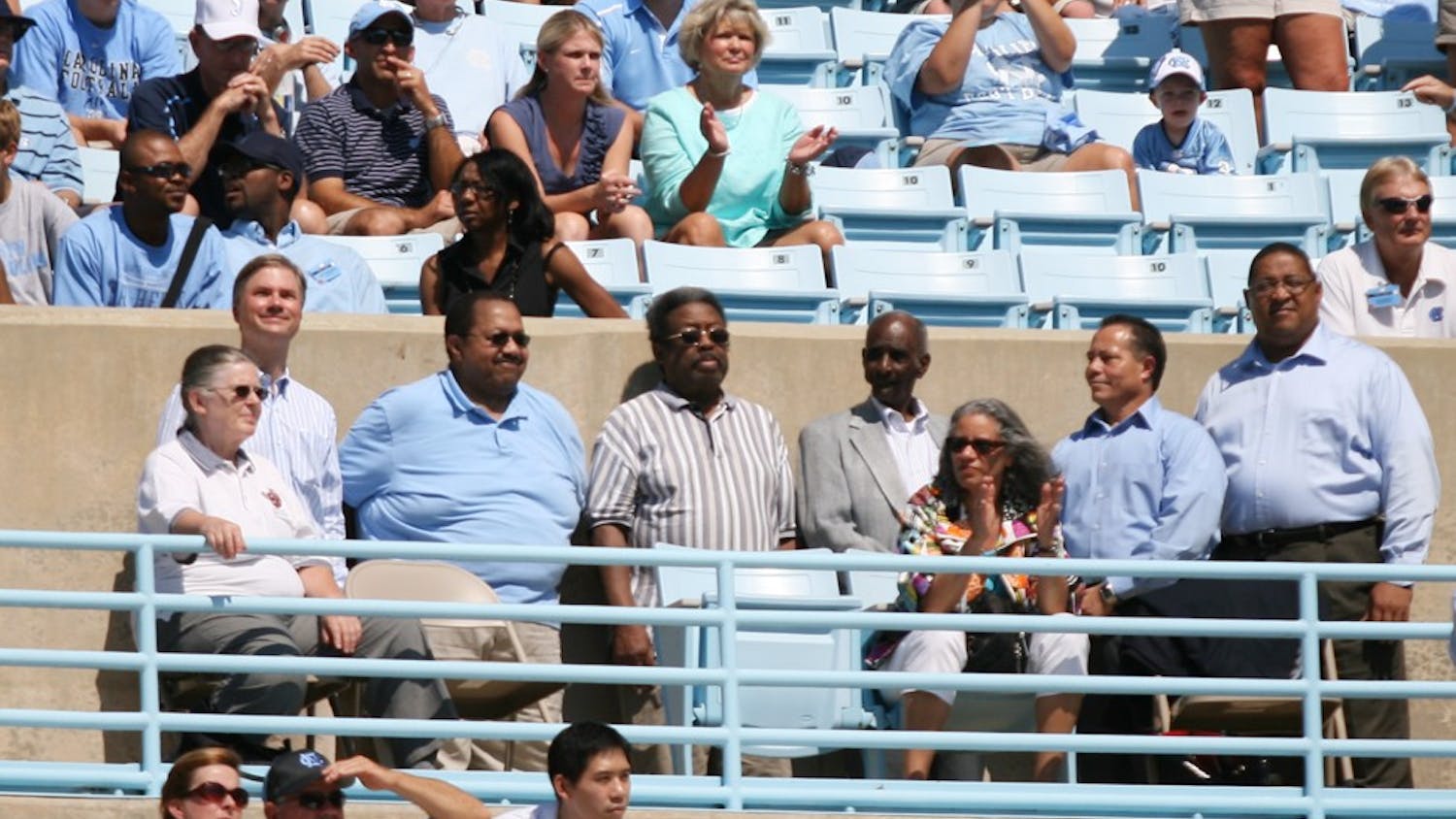 First black students John Lewis Brandon and Ralph and LeRoy Frasier were honored at Saturday’s football game for the 55th anniversary of desegregation at UNC by Chancellor Holden Thorp and Vice Chancellor Winston Crisp.