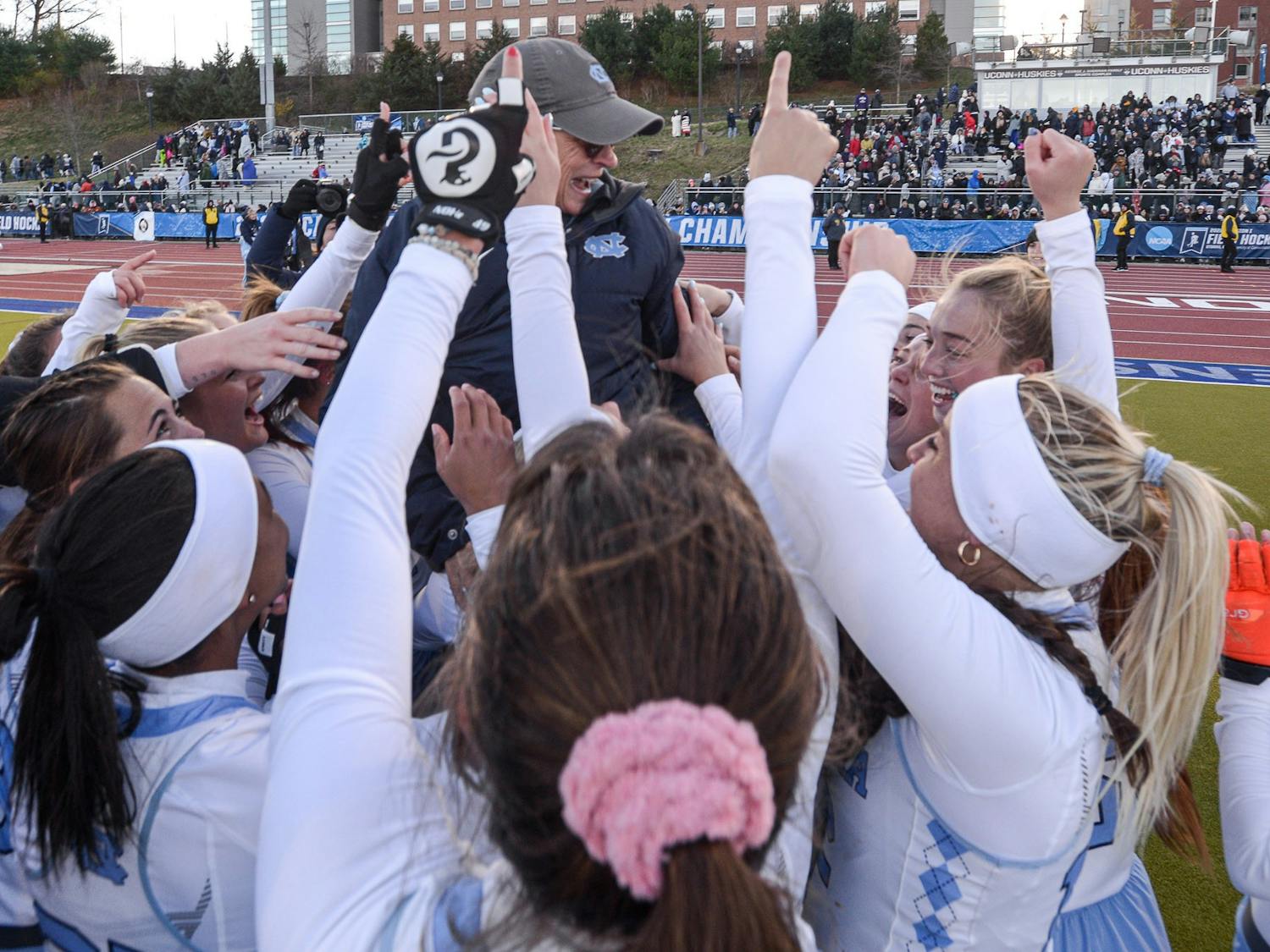 The UNC field hockey team lifts head coach Karen Shelton while celebrating their victory after the NCAA Field Hockey Championship game against Northwestern in Storrs, Conn. on Sunday, Nov. 20, 2022. UNC beat Northwestern 2-1.