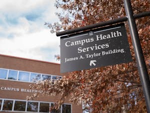 A sign directing community members toward the UNC Campus Health Services building is pictured on Monday, Nov. 29, 2021.  