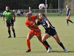 Midfielder Alex Kimball (47) fights for a ball against Virginia Tech defender Jaylyn Thompson (3) in the ACC Tournament quarterfinals on Oct. 28 at WakeMed Soccer Park in Cary. UNC defeated Virginia Tech 2-0 to advance to the semifinals.
