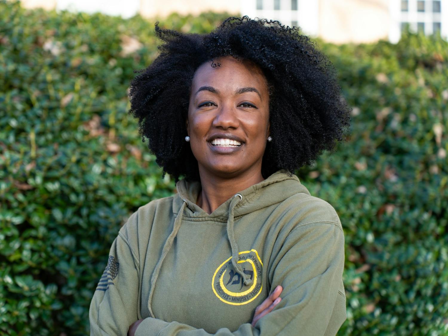 Jaimie Lee, owner and lead instructor at The Coalition NC, poses for a portrait in the Old Quad on Tuesday, Feb. 21, 2023.