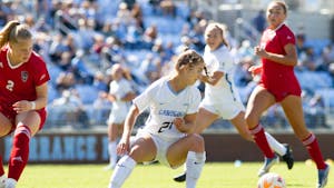UNC first-year forward Ally Sentnor (21) steals the ball during the women's soccer game against NC State on Sunday, Oct. 9, 2022, at Dorrance Field. UNC beat NC State 2-0.