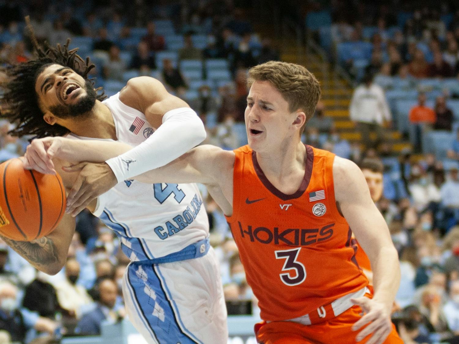 UNC sophomore guard RJ Davis goes for the rebound during UNC Men's basketball's home game against Virginia Tech on Monday, Jan. 24, 2022, at the Dean Smith Center.