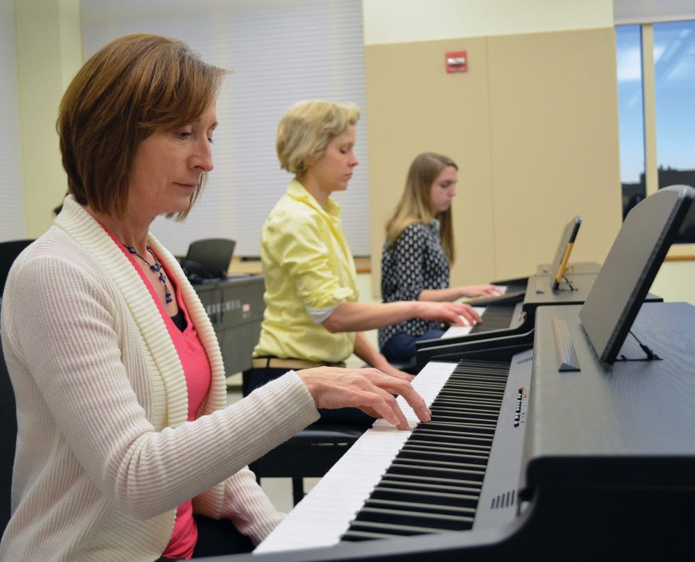 Grace Baranek plays a key in an introductory piano class on Tuesday night in Kenan Music Building as a part of UNC's expanded number of community music courses.
