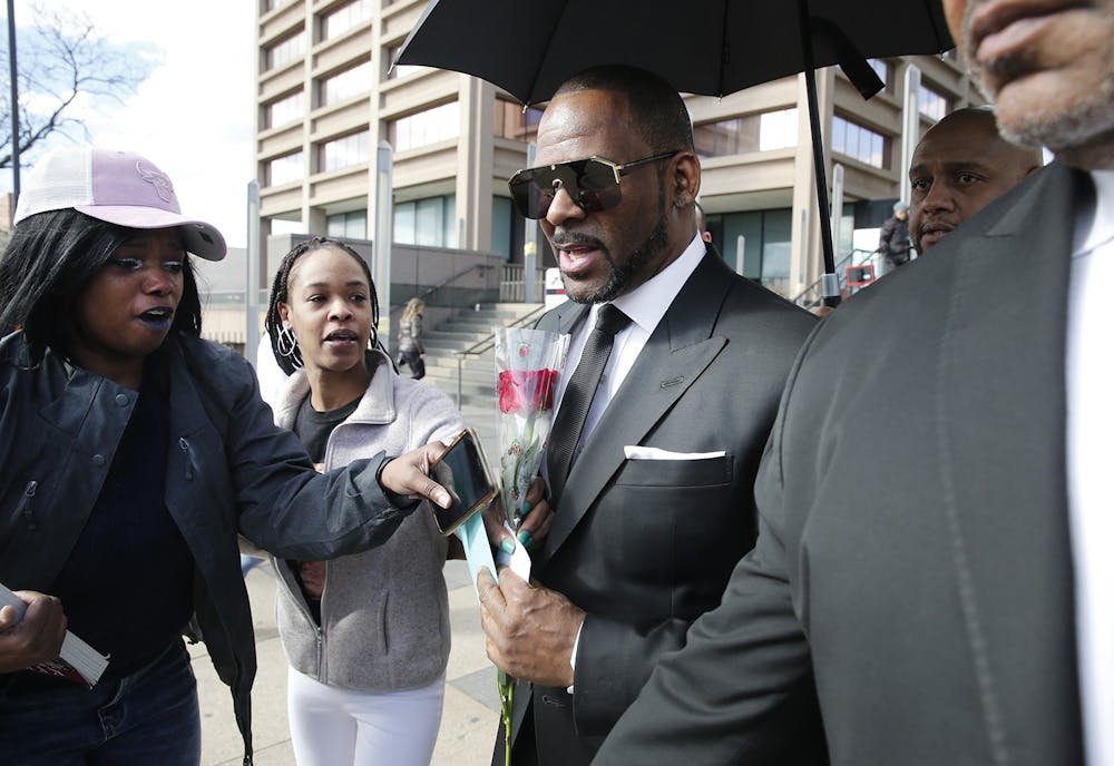 Fans give singer R. Kelly a rose, and cards, outside the Leighton Courthouse on March 22, 2019, in Chicago, Illinois. 
Photo Courtesy of Nuccio DiNuzzo/Getty Images/TNS