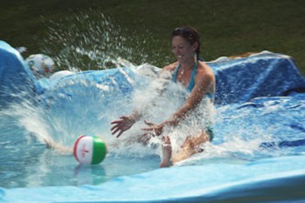 Kyla Basher enjoys the water in a gigantic Slip ‘n Slide created specifically for the Campus Rec Outdoor Rec Fest.
