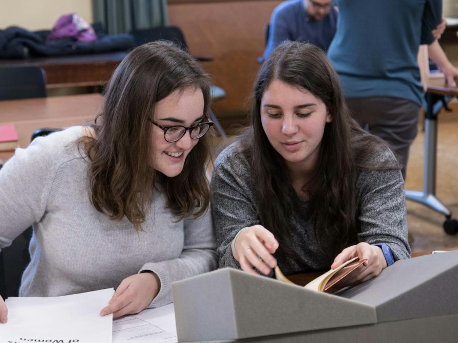 Blythe Gulley and Caroline Alessandro are in UNC Professor Jeanne Moskal’s English class that will present “Reconstructing Frankenstein’s Monster: Mary Shelley’s World in Print” on Thursday in Wilson Library. Photo by Aleah Howell.&nbsp;