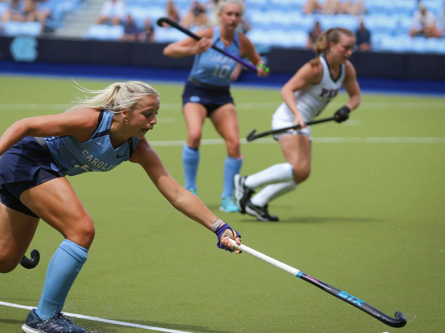 First-year midfielder Ryleigh Heck (12) sprints to prevent an interception from UPenn. UNC beat UPenn at home 4-0 on Sunday, Sept. 4, 2022.
