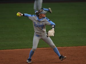 UNC senior second baseman Campbell Hutcherson (5) throws the ball during the Elon Game on Wednesday, Feb. 26, 2020 in G. Anderson Softball Stadium. UNC lost to Elon 2-1.