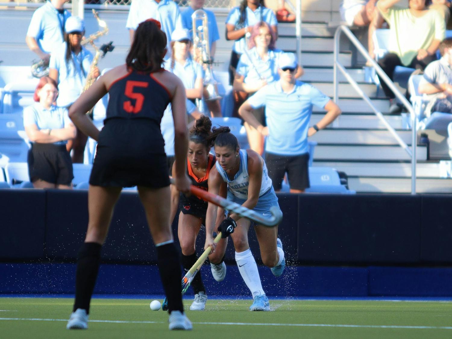 Senior back Romea Riccardo (11) battles with Princeton junior forward Liz Agatucci (18) for the ball as they run down the field. UNC beat Princeton 4-3 at home on Friday, Sept. 2, 2022.