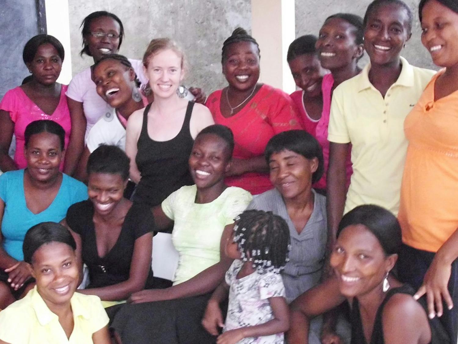 	Reina Galjour (top row, fourth from left), a certified professional midwife and Orange County native, stands with her Haitian students.