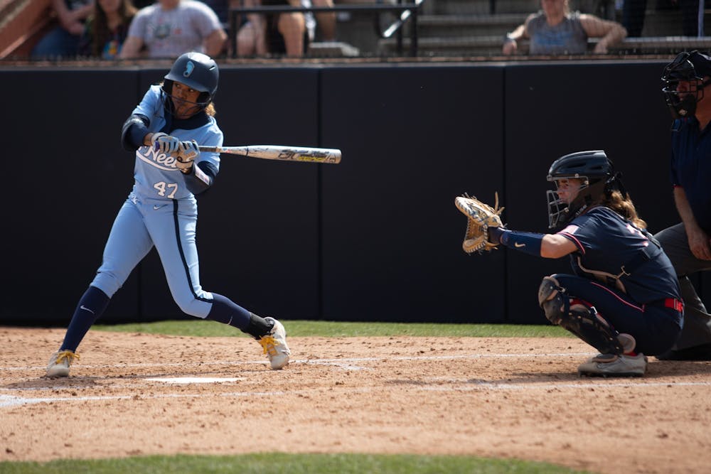 UNC third baseman/short stop and junior Destiny Middleton swings at a pitch during UNC's home game against the University of Connecticut on Sunday, March 6, 2022. UNC picked up an 8-7 win as part of the Carolina Classic softball tournament.