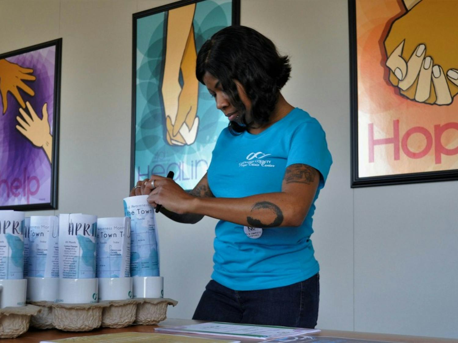 Laing, Orange County Rape Crisis Center's Business and Finance Manager, gets prizes ready for guests at the OCRCC's Housewarming and 45th Birthday Kickoff event on Friday, March 22, 2019. OCRCC's new office is located at 1506 E. Franklin St. #200, Chapel Hill, NC 27514.
