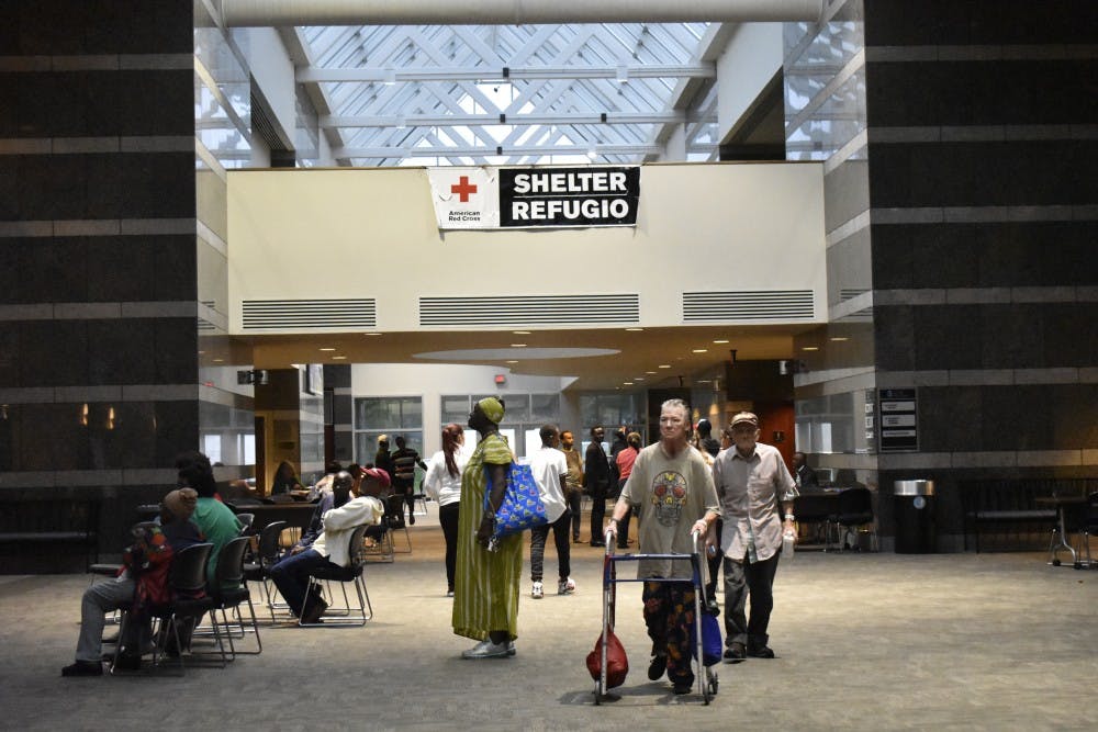 <p>Many seek refuge from Florance's rain at the Friday Center Shelter on Sunday, Sept. 16.&nbsp;</p>