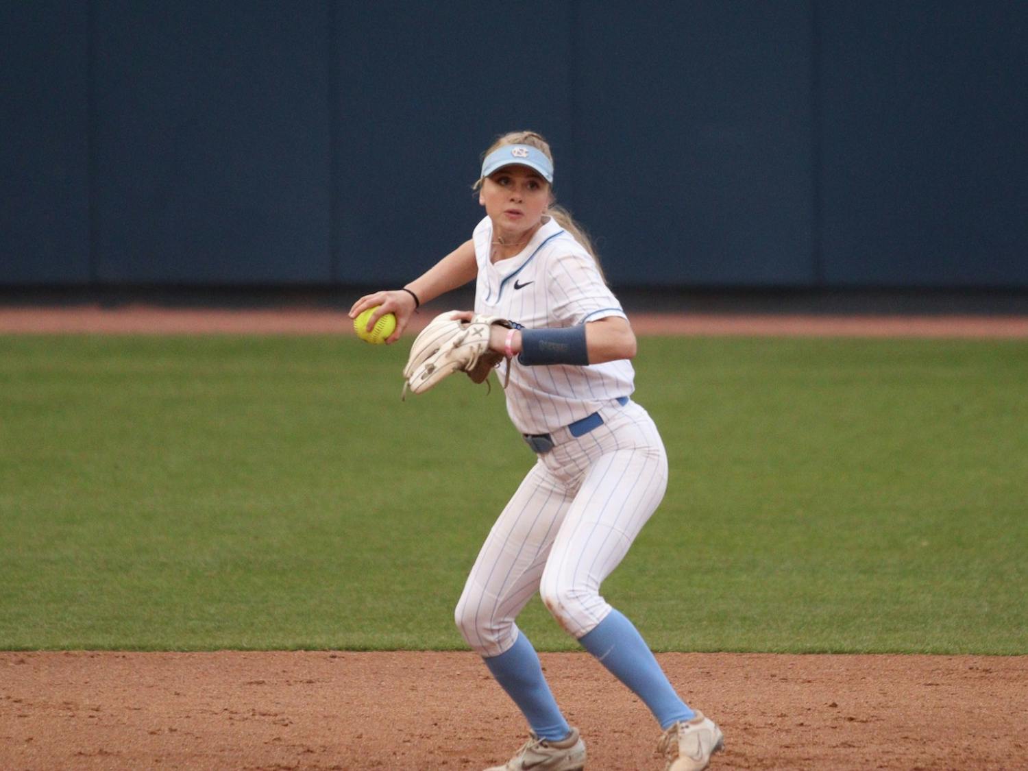 Utility player Alex Brown (5) prepares to throw to first base during a home game against UNCW. The Heels won 2-0 on Tuesday, March 15, 2022.