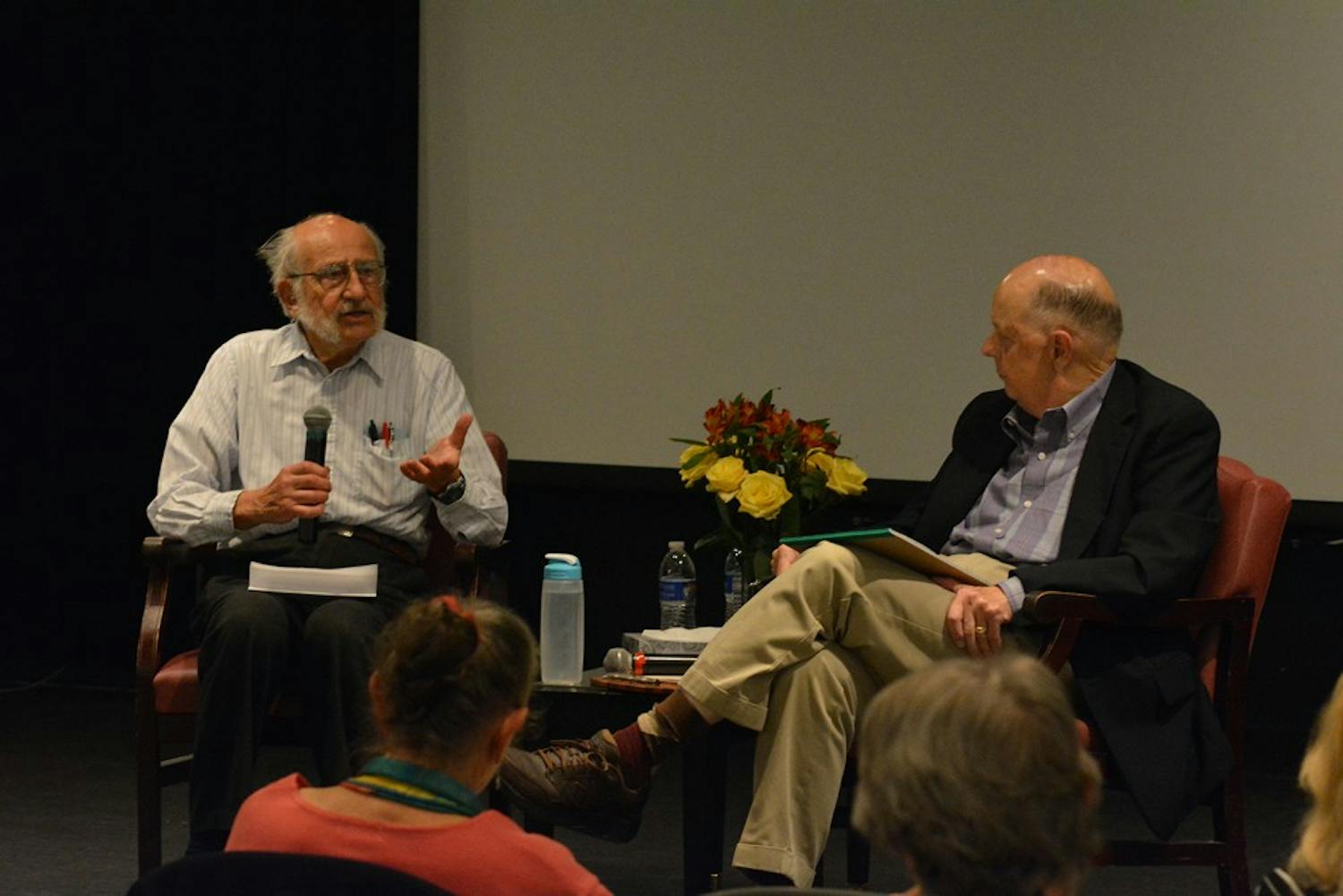 Tom Wolf (left) talks to Bill Crittenden about having conversations about death and dying at the Seymour Center on Thursday night. 