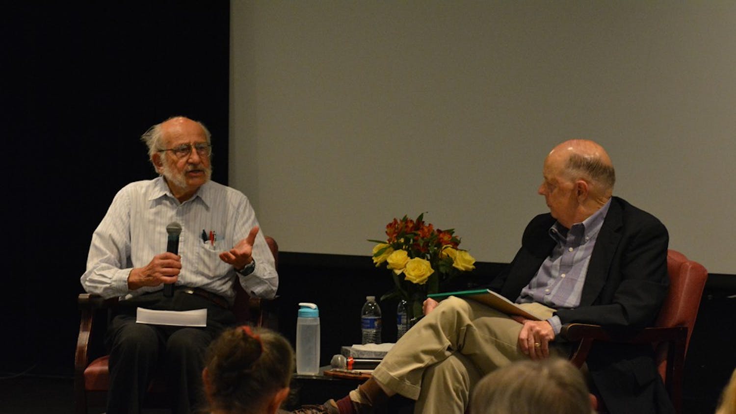 Tom Wolf (left) talks to Bill Crittenden about having conversations about death and dying at the Seymour Center on Thursday night. 