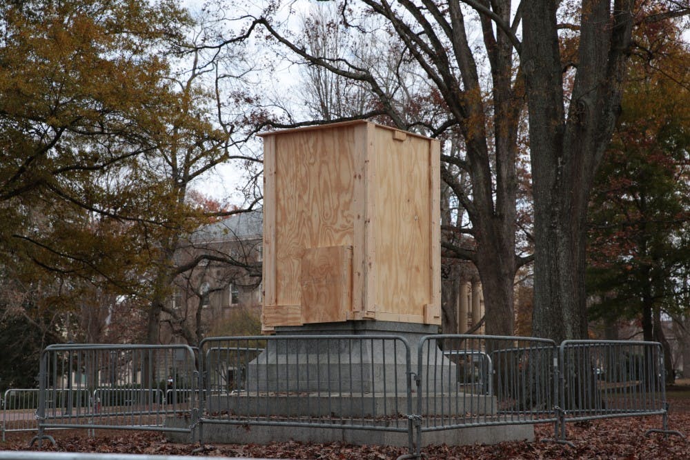 A wooden box surrounds the pedestal where Silent Sam stood on Monday, Dec. 3, 2018. 