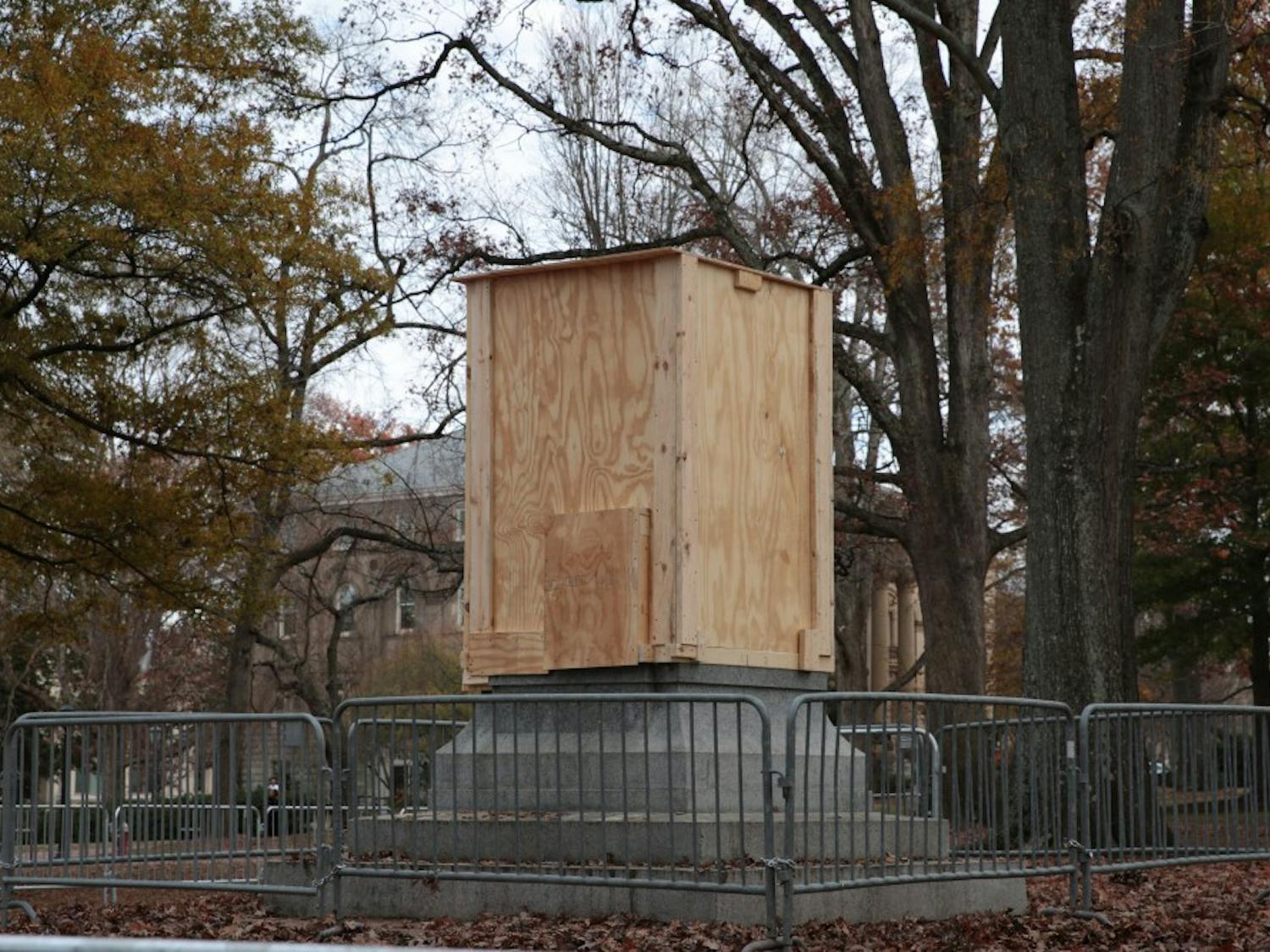 A wooden box surrounds the pedestal where Silent Sam stood on Monday, Dec. 3, 2018. 