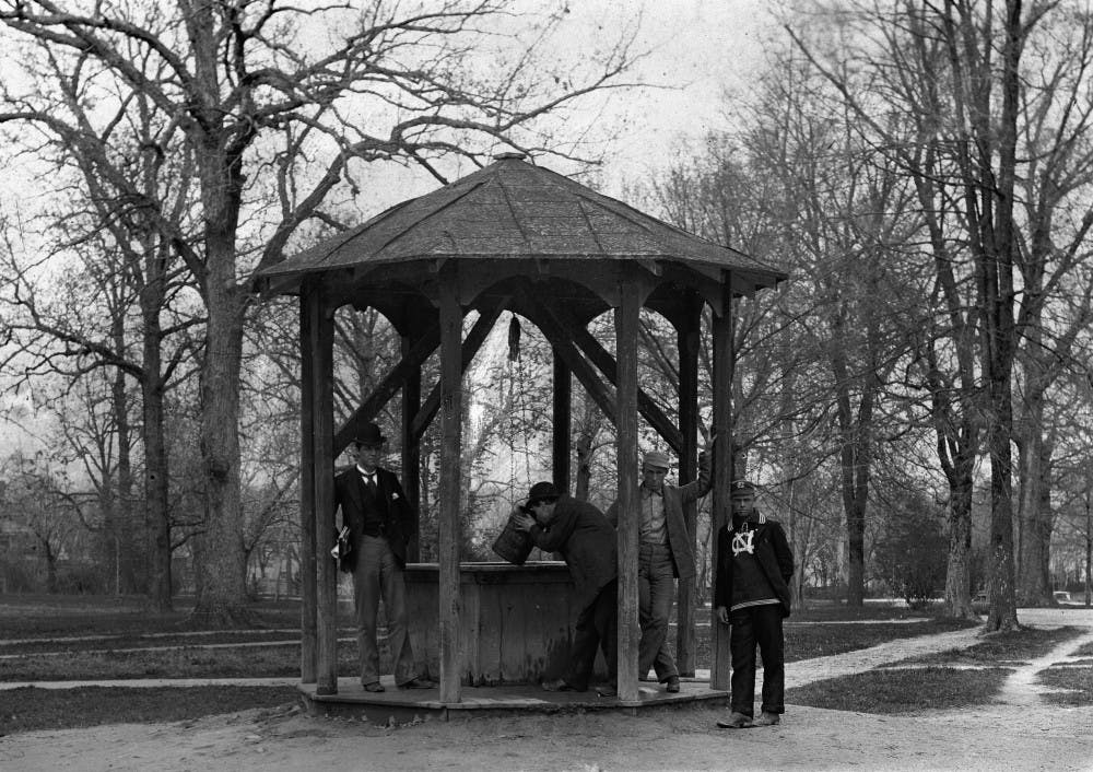 A man drinking from the bucket at the "Old" Old Well at the University of North Carolina at Chapel Hill, 1892.  Photograph from the Kemp Battle Album, North Carolina Collection, University of North Carolina at Chapel Hill.