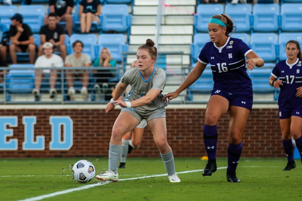 Freshman forward Emily Murphy (35) moves the ball past the defense at the home game against Northwestern on Sept 2. UNC won 2-0.