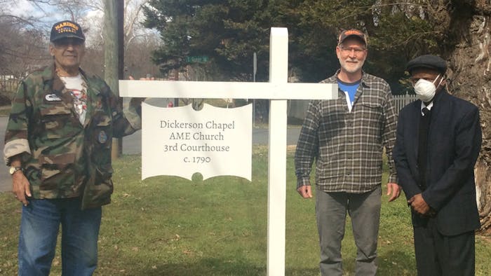 John Blackfeather Jeffries, Gregg Phillips, and Rev. Holman (left to right), pose with the new sign at the Dickerson Chapel. Photo courtesy of Tanya Day.