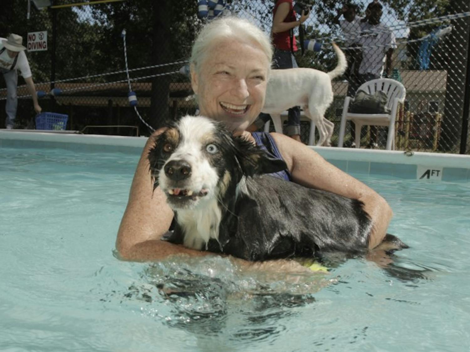 	Greta Johnson brought her dog Cody to the Dog Swim at the A.D. Clark Pool, Sunday. Admission was $5 per dog and goes to Chapel Hill Parks and Recreation.
