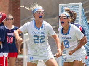 UNC junior attacker Tayler Warehime (22) and UNC redshirt-senior attacker Katie Hoeg (8) celebrate after Tayler scores a goal  at the quarterfinals of the NCAA tournament against Stony Brook at the Dorrance Field in Chapel Hill on Saturday May 22, 2021. The Tar Heels won 14-11.