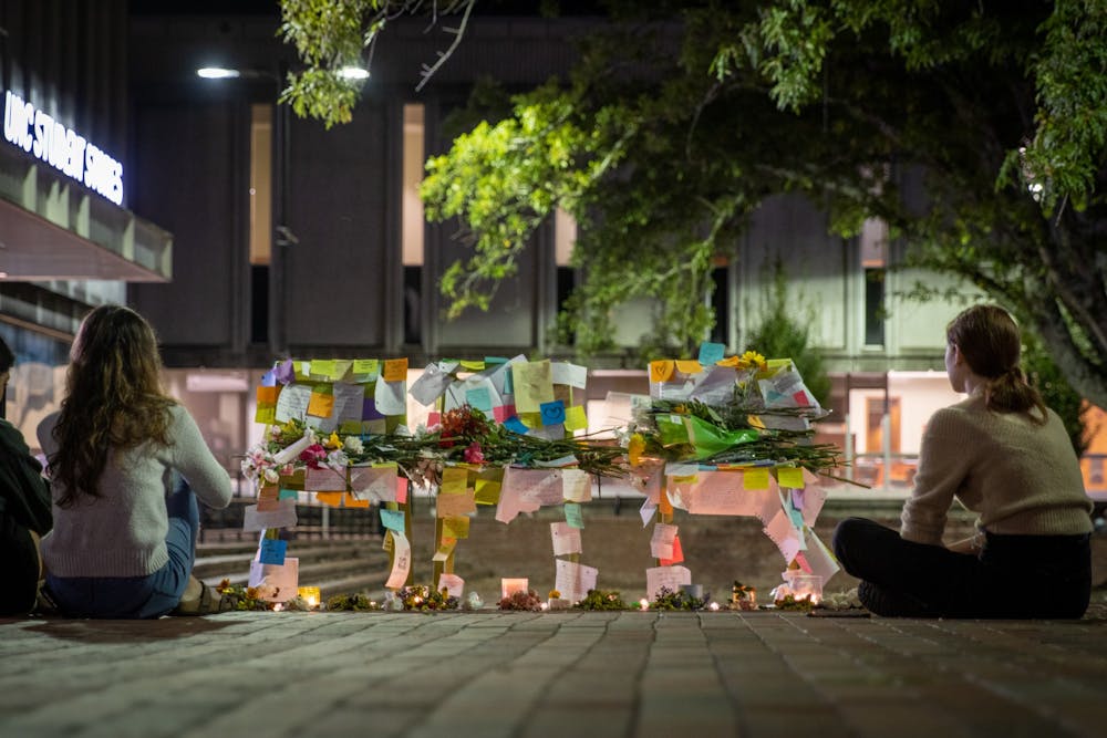 A makeshift memorial was set up in the Pit on Monday as students and faculty mourned the losses of the weekend. Passersby left notes of encouragement and flowers.